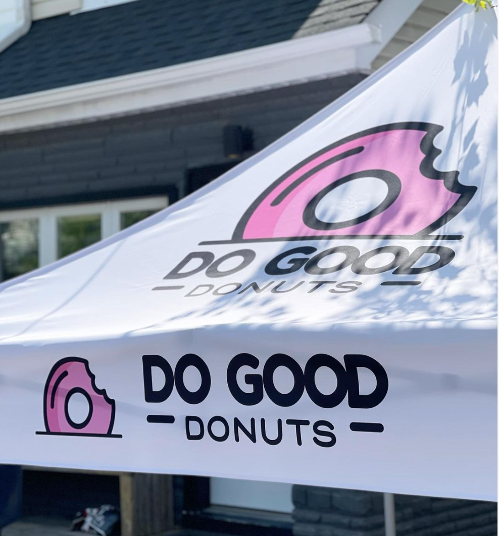 Do Good Donuts logo on a tent 